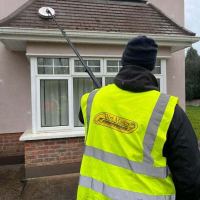 Exterior cleaning contractor inspecting property